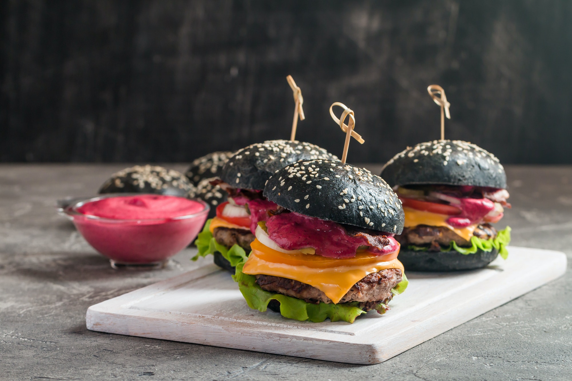 THE NEW BLACK BURGER WITH SPICE TASTE TO SATISFY YOU